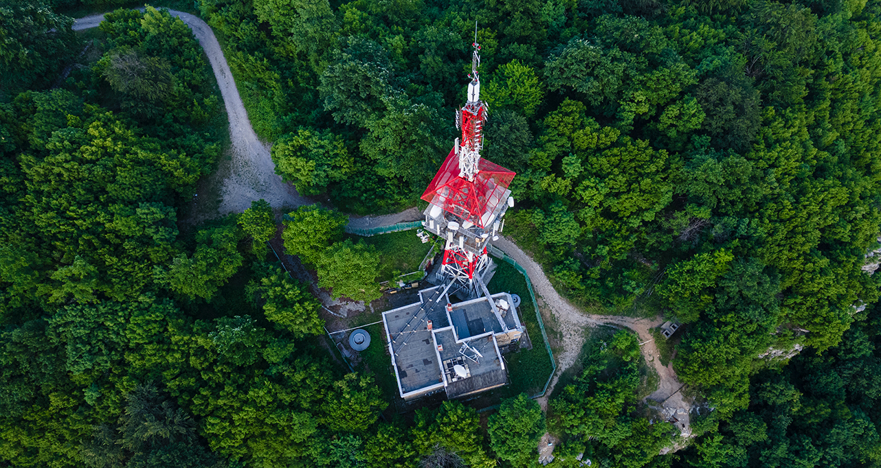 Aerial view of telecommunications tower in the middle of forest