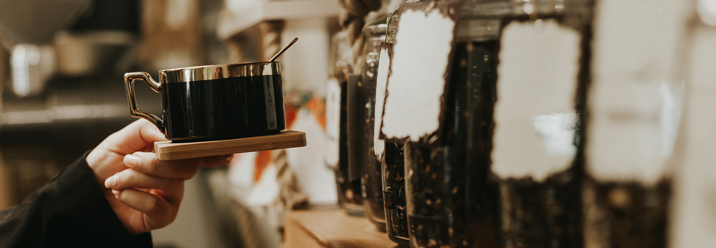 Close up shot of a person holding a cup