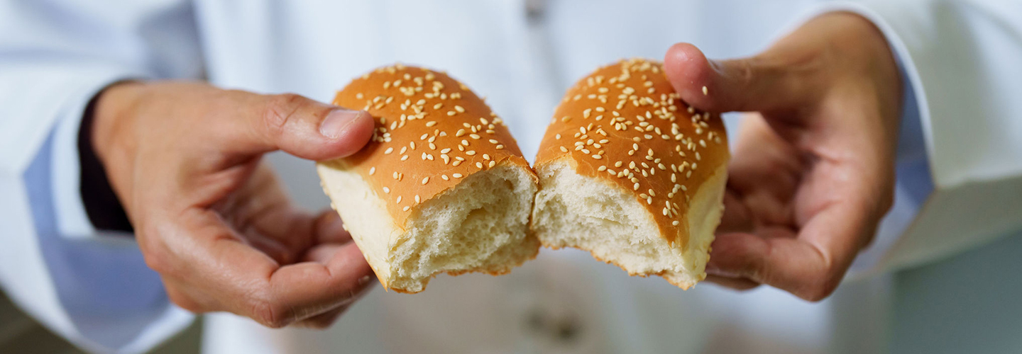 Close up shot of a person holding bread