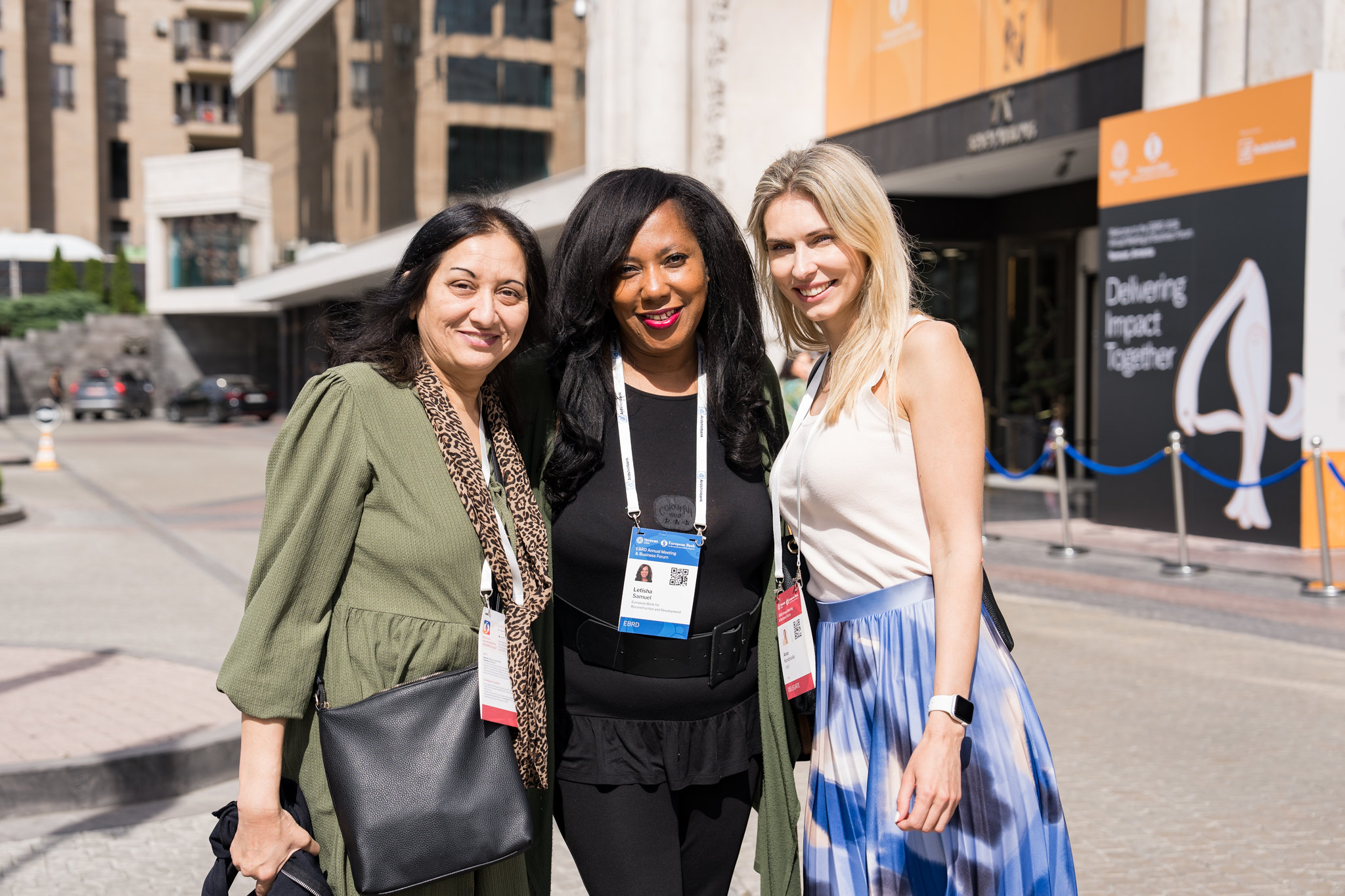 three women standing outside a corporate events venue