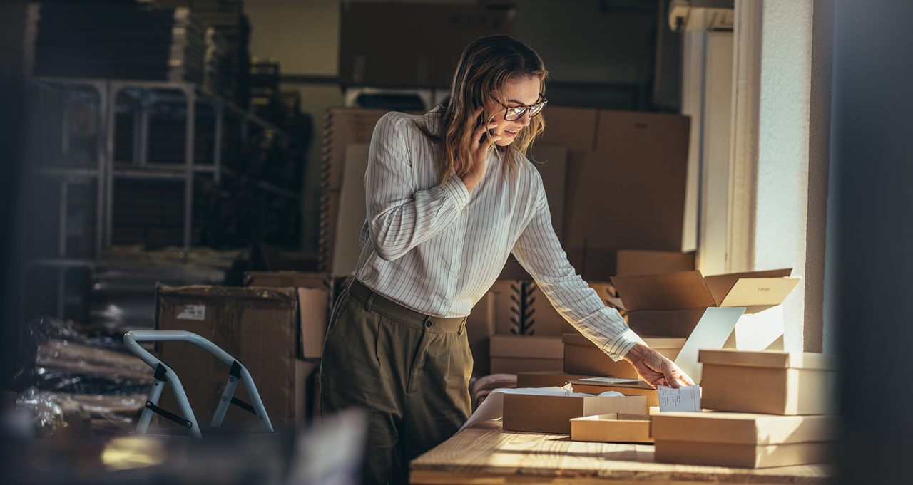 Woman on phone in home office Woman on phone in home office