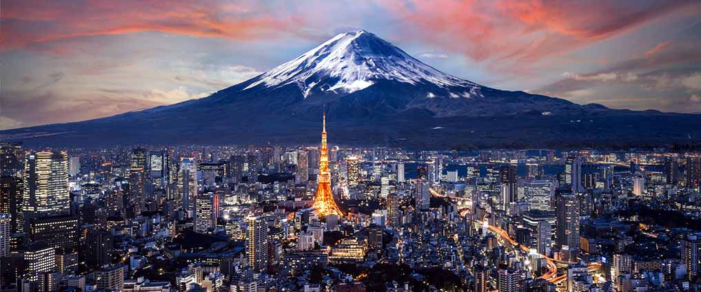 aerial view of Tokyo's skyline, with Mt Fuji behind